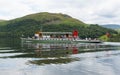 Ullswater Steam ferry with holidaymakers and tourists Lake District with green hills