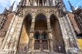 Ulm Minster or Cathedral of Ulm city, Germany. Front view of beautiful entrance of famous Gothic church in summer