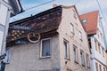 Rustic Charm and Timeless Craftsmanship: A Wrought Iron Sign on a Fachwerk House in Ulm\'s Old Town