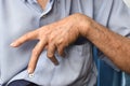 Ulnar claw hand of Asian elder man. also known as & x27;spinster& x27;s claw