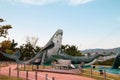 Ulsan,South Korea-April 2018:Close up image of huge whale statue jumping out from water at Jangsaengpo Whale Cultural Park