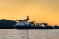 Offshore vessel Island Victory in the fjord of Norway with beautiful sunset