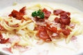 Ultimate Pasta spaghetti carbonara recipe is Traditional Italian food sprinkle on top with bacon and Fresh Parsley in a cream