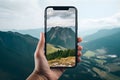 Phone screen and a mountain scene of the harmonious blending of technology and nature. AI Generated