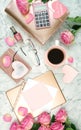 Ultra feminine pink desk workspace with rose gold accessories flatlay.