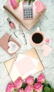 Ultra feminine pink desk workspace with rose gold accessories flatlay. Royalty Free Stock Photo