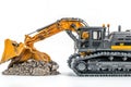 Model Excavator Digging into a Pile of Dirt Royalty Free Stock Photo