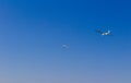 Ultra light, cessna plane drag on glider with prolonge rope on blue sky. Sport, aviation background