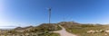 Ultra panoramic view at the Caramulomountains, with wind turbines and blue sky as background