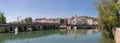 Ultra panoramic view at the Tomar city downtown, with NabÃÂ£o river, old city bridge, PouchÃÂ£o park and the iconic Tomar Castle and