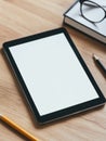 Ultra realistic image of modern tablet on wooden desk with glasses and notebook Royalty Free Stock Photo