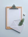 Ultra realistic vertical mockup of blank white clipboard with envelope and star decor Royalty Free Stock Photo