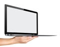 Ultra Thin laptop on hand Isolated