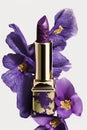 Ultra violet lipstick on a white background with purple flower. Generative AI