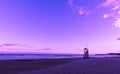 Ultra violet beach sunrise with lifeguard wooden tower