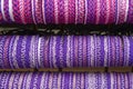 Ultra violet wristbands. Purple textured background. Hand made