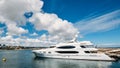 Ultra wide angle of a luxurious super yacht docked at Cascais marina. The Marina is located under Cascais Cidadela