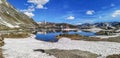 Ultra wide panorama of the lake in the Gotthardpass with snow Royalty Free Stock Photo