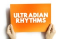 Ultradian rhythm is a recurrent period or cycle repeated throughout a 24-hour day, text concept on card