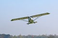 Ultralight airplane flying in a blue sky Royalty Free Stock Photo