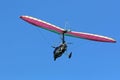 Ultralight airplane flying a blue sky Royalty Free Stock Photo