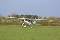 Ultralight airplane taxiing on a farm strip Royalty Free Stock Photo