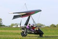 Ultralight airplane taxiing on a farm strip Royalty Free Stock Photo