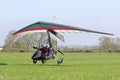 Ultralight airplane taxiing on a farm strip Royalty Free Stock Photo