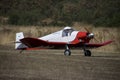 Ultralight plane flying in an airfield