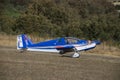 Ultralight plane flying in an airfield Royalty Free Stock Photo