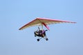Ultralight airplane flying in a blue sky Royalty Free Stock Photo