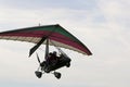 Ultralight airplane flying in a blue sky Royalty Free Stock Photo