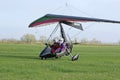 Ultralight airplane taxiing on a farm strip Royalty Free Stock Photo