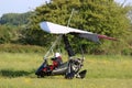 Ultralight airplane taxiing on a farm strip Royalty Free Stock Photo