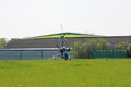 Ultralight airplane taxiing on a farm strip Royalty Free Stock Photo