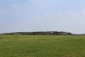 Ultralight plane pull glider to sky with forest in background