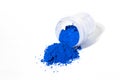 ultramarine pigment, dry paint on a white background, macro Royalty Free Stock Photo