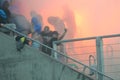 Ultras hooligans supporters burn flares during match Royalty Free Stock Photo