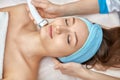 Ultrasonic face cleaning, peeling, in a beauty salon Royalty Free Stock Photo