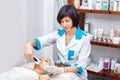 Ultrasonic face cleaning, peeling, in a beauty salon Royalty Free Stock Photo
