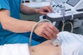 Ultrasound diagnostic of stomach on abdominal to woman in clinic, closeup. Royalty Free Stock Photo