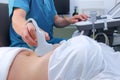 Ultrasound diagnostic of stomach on abdominal to woman in clinic, closeup. Royalty Free Stock Photo