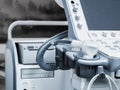 Ultrasound machine with buttons, sensors and monitor. Modern medical equipment in white gray. Details. Close-up. Doctors office Royalty Free Stock Photo