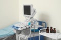 Ultrasound machine, medical trolley and examination table in hospital Royalty Free Stock Photo