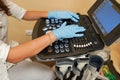 Ultrasound medical device for diagnostics, female doctor hands on the computer