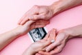 Ultrasound picture pregnant baby photo. Woman hands holding ultrasound pregnancy image on pink background. Concept of Royalty Free Stock Photo