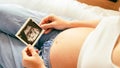 Ultrasound picture pregnant baby photo. Woman holding ultrasound pregnancy image. Concept of pregnancy, maternity Royalty Free Stock Photo