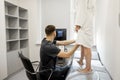 Ultrasound specialist scans veins on a woman& x27;s leg