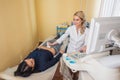 Ultrasound test. Pregnancy. Gynecologist checking fetal life with scanner. Exam. Royalty Free Stock Photo