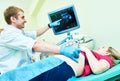 Ultrasound test. Pregnancy. Gynecologist checking fetal life with scanner. Royalty Free Stock Photo